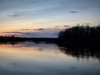 Mystical sunset over the river. Beautiful sunset sky. Nature background. purple sunset over the lake