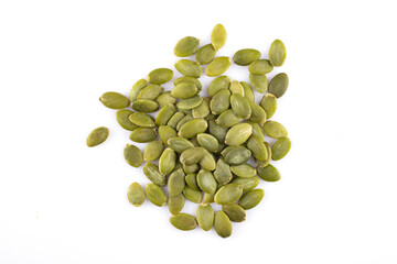 Delicious pumpkin seeds on white background