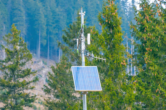 a weather monitoring and communication station powered by a solar panel.