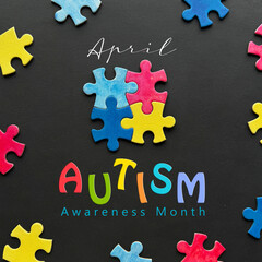 Autism Awareness Month concept with colorful puzzle pieces and text 