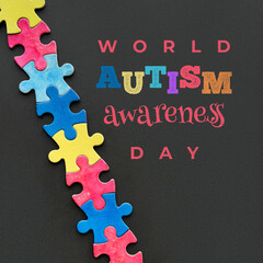 Colorful puzzle pieces on black background with text 