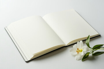 Minimal photo of an open blank notebook with soft flower decoration on a clean background, ideal for journaling, writing, or lifestyle content.