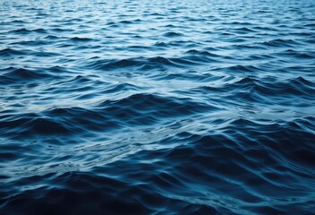 Gentle Ocean Waves Rolling in Deep Blue Water Surface