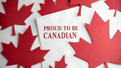 Canada Day paper cutout concept with bold maple leaf shapes and message &ldquo;Proud to be Canadian&rdquo; ideal for patriotic visuals and editorial design