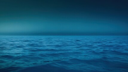 Obraz premium A dark blue ocean with a few waves