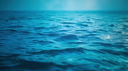 Obraz premium A dark blue ocean with a few waves