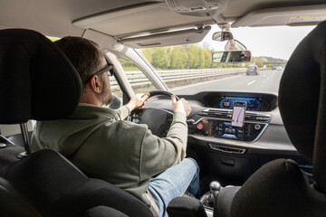 Hands on the wheel when driving at high speed from inside the car.
