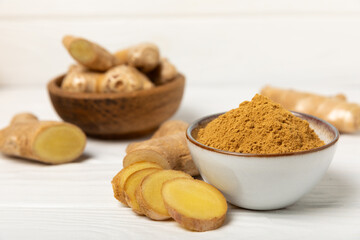 Fresh ginger on wooden background. Dry ginger. Sliced ​​ginger with honey and lemon. Ginger root. Traditional alternative medicine, healing tea for immunity. Seasoning and spices concept. Copy space.