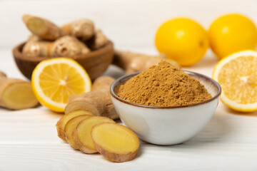 Fresh ginger on wooden background. Dry ginger. Sliced ​​ginger with honey and lemon. Ginger...
