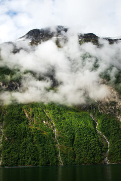 Clouds over the fjord mountains