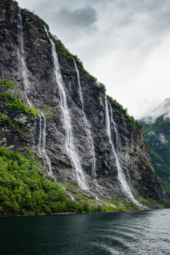 Waterfall falling into fjord in Norway