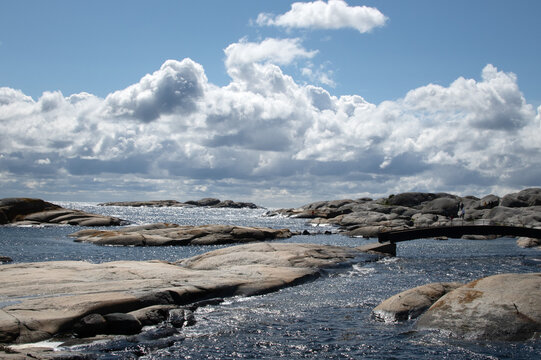 Rocks in the sea with dramatic clouds background