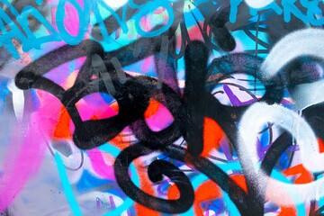 Dynamic graffiti art with neon blue, pink, black. 80s urban style, fluorescent accents, bold shapes. Urban murals, digital art, creative backgrounds.