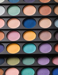 Close up of a pastel color eye shadow pallet for neutral and natural make-up. Produced with Generative AI.