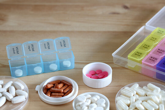 Organizing pills and medications with daily and weekly pillboxes for efficient healthcare management