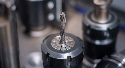 Close up of industrial drill bit. Use for topics related to industrial tools, manufacturing and machining. Selective focus.