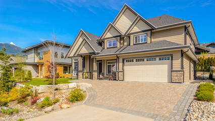 Garage door in luxury house with trees and nice landscape in Summer in Vancouver, Canada, North...