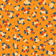 Seamless floral pattern. Cute field of flowers of small white and orange flowers and blue leaves. Light flowers on yellow background in Easter spring vintage print. Stock vector for prints on surface.