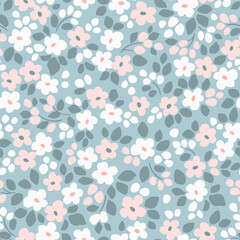 Seamless floral pattern. Cute field of flowers of small pink and white flowers and gray leaves. Pastel flowers on blue background in Easter spring vintage print. Stock vector for prints on surface.
