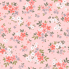 Beautiful floral pattern in small vintage flowers. Small white and red flowers. Light pink background. Ditsy print. Floral seamless background. Gentle template for fashion prints. Stock pattern.