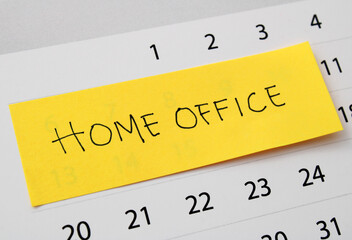 Home office, sticky note marking days on the calendar