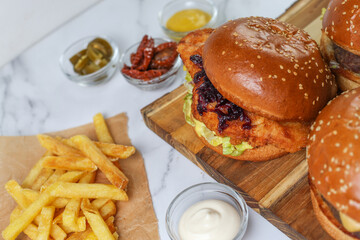 Homemade delicious burger and ketchup, fries.