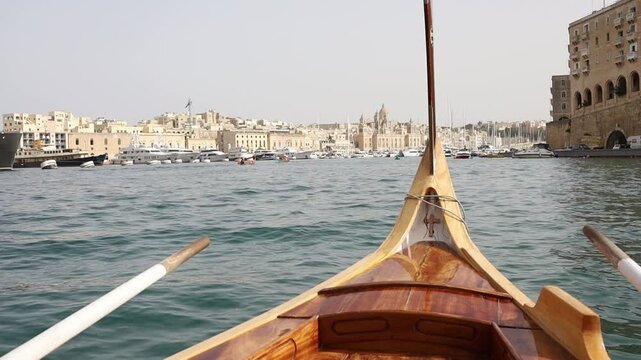 Birgu town view from authentic traditional maltese luzzu boat