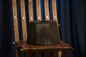 black old hat on a old chair