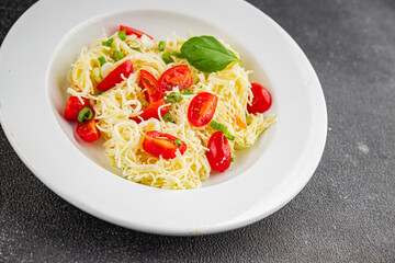 Pasta with tomatoes vermicelli vegetables dish fresh delicious gourmet food background on the table rustic food top view copy space