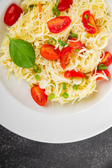 Pasta with tomatoes vermicelli vegetables dish fresh delicious gourmet food background on the table rustic food top view copy space