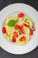 Pasta with tomatoes vermicelli vegetables dish fresh delicious gourmet food background on the table rustic food top view copy space