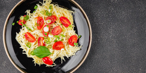 Pasta with tomatoes vermicelli vegetables dish fresh delicious gourmet food background on the table rustic food top view copy space