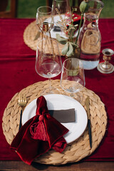 Elegant outdoor table setting with red and white decor
