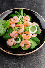 Shrimp salad seafood dish fresh gourmet food background on table rustic food top view copy space