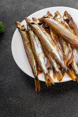 Smoked sprat fish capelin dish fresh gourmet food background on table rustic food top view copy space pescetarian diet