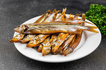 Smoked sprat fish capelin dish fresh gourmet food background on table rustic food top view copy space pescetarian diet