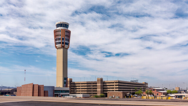 Phoenix, AZ - March 31, 2025: Airport Traffic Control Tower (ATCT) and Terminal Radar Approach Control (TRACON) at the Phoenix Sky Harbor International Airport.