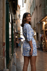 Beautiful young mixed race woman in the old town of Nice, France