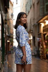 Beautiful young mixed race woman in the old town of Nice, France