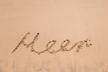 The word “Meer” written in smooth beach sand, perfect for travel, vacation, or seaside memory...
