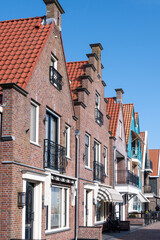 Fototapeta premium Tourists destination in North Holland, old authentic fishermen village Volendam near Amsterdam with old houses and narrow streets