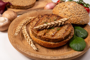 Make burger buns with vegan or vegetarian patties or burgers made from grains, vital wheat gluten food, grilled healthy food