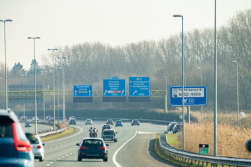 Obraz premium Road network infractrusture in Netherlands, driving safe on high quality asphalt on Dutch highways, A2, traffic jam problems, road construstion, many cars, rush hours