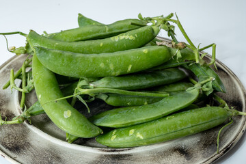 New harvest of fresh ripe green peas legumes