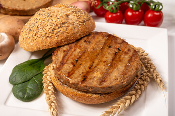 Make burger buns with vegan or vegetarian patties or burgers made from grains, vital wheat gluten food, grilled healthy food
