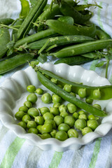 New harvest of fresh ripe green peas legumes