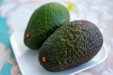 Green ripe avocado from organic avocado plantation - healthy food