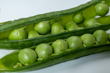 New harvest of fresh ripe green peas legumes