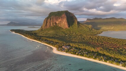 Obraz premium Aerial view of Le Morne Peninsula and sea lagoon formed by coral reefs, Mauritius Island, Africa, Indian Ocean 