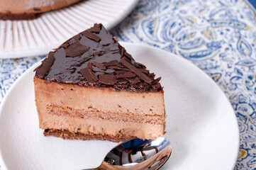 Piece of dark chocolate ice cream frozen cake on board